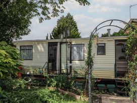 A trailer with plants and an archway at 10 Cater Gardens Guildford