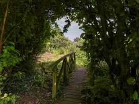 A pathway leading through greenery at Owl in Pickering