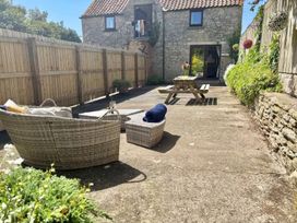 An outdoor space with seating and a table at Owl in Pickering