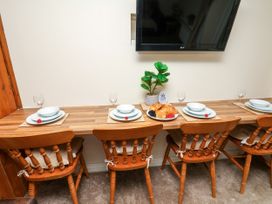 A dining room with a table set for four at Owl in Pickering