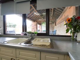 A kitchen with a sink and countertop at Owl in Pickering