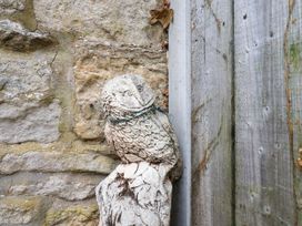 Owl sculpture on a stone wall at Owl in Pickering