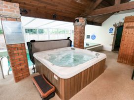 A hot tub in a spa room at Owl in Pickering