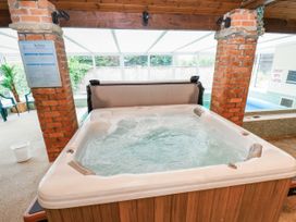A hot tub in a spa room at Owl in Pickering