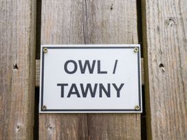 A sign indicating OWL / TAWNY at Owl in Pickering
