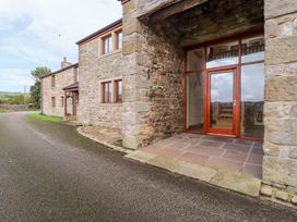 An entrance area with stone walls and a front door at Shepherd's Barn in Lancaster