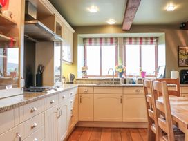 A kitchen with a sink and countertop at Shepherd's Barn in Lancaster