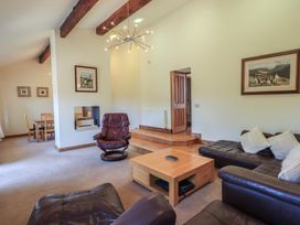 A living room with a sofa and coffee table at Shepherd's Barn in Lancaster