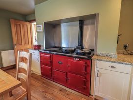 A kitchen with a red stove and oven at Shepherd's Barn in Lancaster