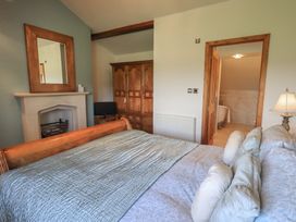 A bedroom with a bed and storage cabinet at Shepherd's Barn in Lancaster