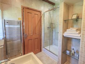 A bathroom with a shower and towels at Shepherd's Barn in Lancaster