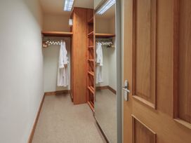 A closet with shelves and a mirror at Shepherd's Barn in Lancaster