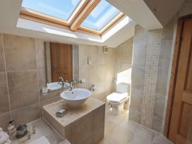A bathroom with a sink and toilet at Shepherd's Barn in Lancaster