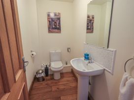 A bathroom with a toilet and sink at Shepherd's Barn, Lancaster