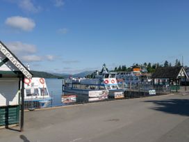 A pier with boats at Hillside Cottage Bowness-On-Windermere