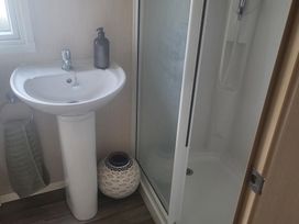 A sink and shower area in the bathroom at 164 Broadland Sands Holiday Park Lowestoft