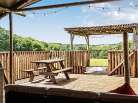 An outdoor area with a table and benches at Luxury Safari Lodge Sleeps 4/6 Deer Park Dogs Ok Zeal Monachorum near Bow