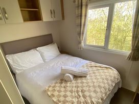 A bedroom with a double bed and window at the property