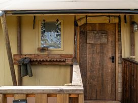 An entryway with a wooden door and coat rack at Luxury Safari Lodge Sleeps 4/6 Deer Park Dogs Ok Zeal Monachorum near Bow