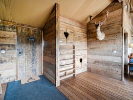 An entryway with wooden walls and a staircase at Luxury Safari Lodge Sleeps 4/6 Deer Park Dogs Ok Zeal Monachorum near Bow
