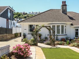 A house with garden and flowers at 3 Heath Park Brixham