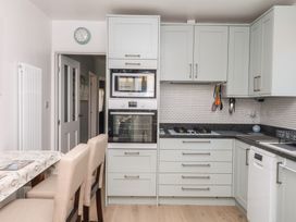 A kitchen with appliances including an oven and stove at 3 Heath Park in Brixham