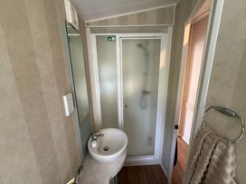 A bathroom featuring a sink and shower at Haggerston Castle Lakeside East 76 Berwick-upon-Tweed