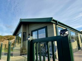 A building with a number and sign at The Stables in Pwllheli