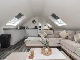 A living room with a sofa and coffee table at Fields view in Bridlington