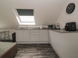A kitchen with appliances and a table at Fields view in Bridlington