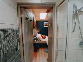A view into a bedroom from a bathroom at TyCosy St Davids