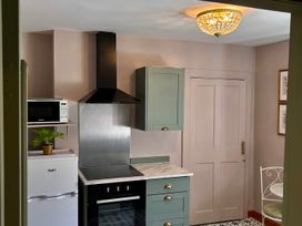 A kitchen with appliances and cabinets at Downton II in Alnwick