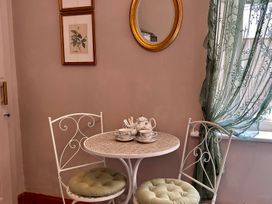 A dining room with a table and chairs at Downton II in Alnwick
