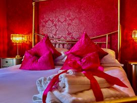 A bedroom with a bed and pillows at Downton II in Alnwick