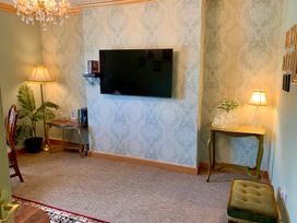 A living room with a television and lamp at Downton II in Alnwick
