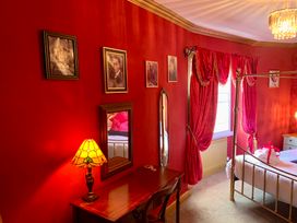 A bedroom with a bed and furniture at Downton II in Alnwick