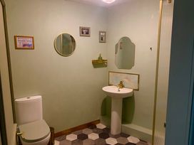 A bathroom with a toilet and sink at Downton II in Alnwick