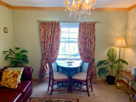 A dining area with a table and chairs at Downton II in Alnwick