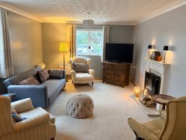 A living room with a sofa and television at No 1 The Martins Walberswick