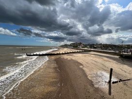 A beach view with sand and water at No 1 The Martins Walberswick