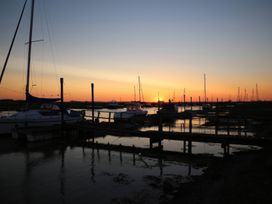 A marina with boats and a sunset at No 1 The Martins, Walberswick