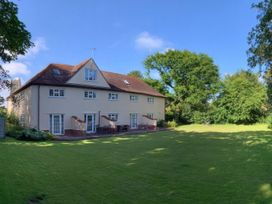 A large house with a garden and patio at No 1 The Martins in Walberswick