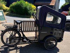 A bicycle with a hatch at the Tuck shop in Walberswick