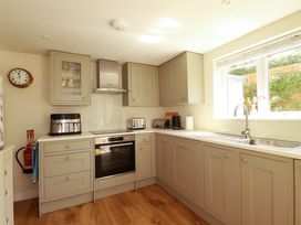 A kitchen with cabinets and appliances at Mary’s House