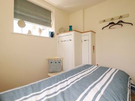 A bedroom with a bed and wardrobe at Mary’s House