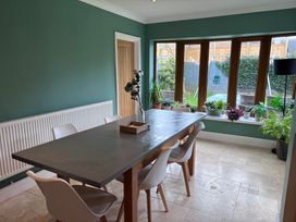 A dining room with a table and chairs at 7 Adrian Close Porthcawl