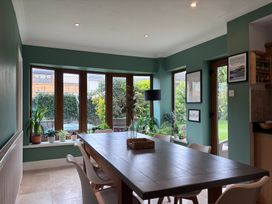 A dining room with a table and chairs at 7 Adrian Close Porthcawl