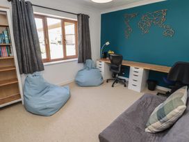An office with a desk and bean bags at Ty Traeth in Porthcawl