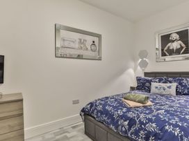 A bedroom with a bed and a television at 1 Bed Flat - Sleeps 2 - Parking - Wifi in Scarborough