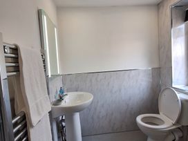 A bathroom with a sink and toilet at Holiday home guest house in Llandudno